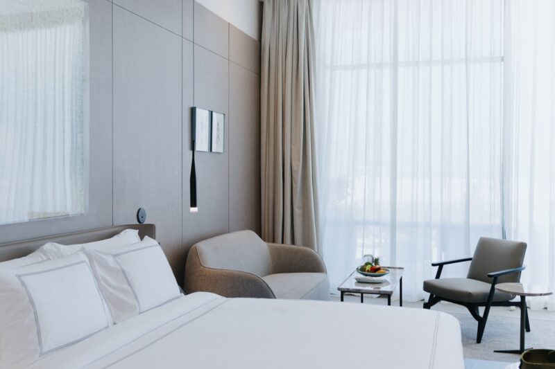 Experience elegance in our Deluxe Pool View room, featuring a private balcony with serene views of shimmering waters.
