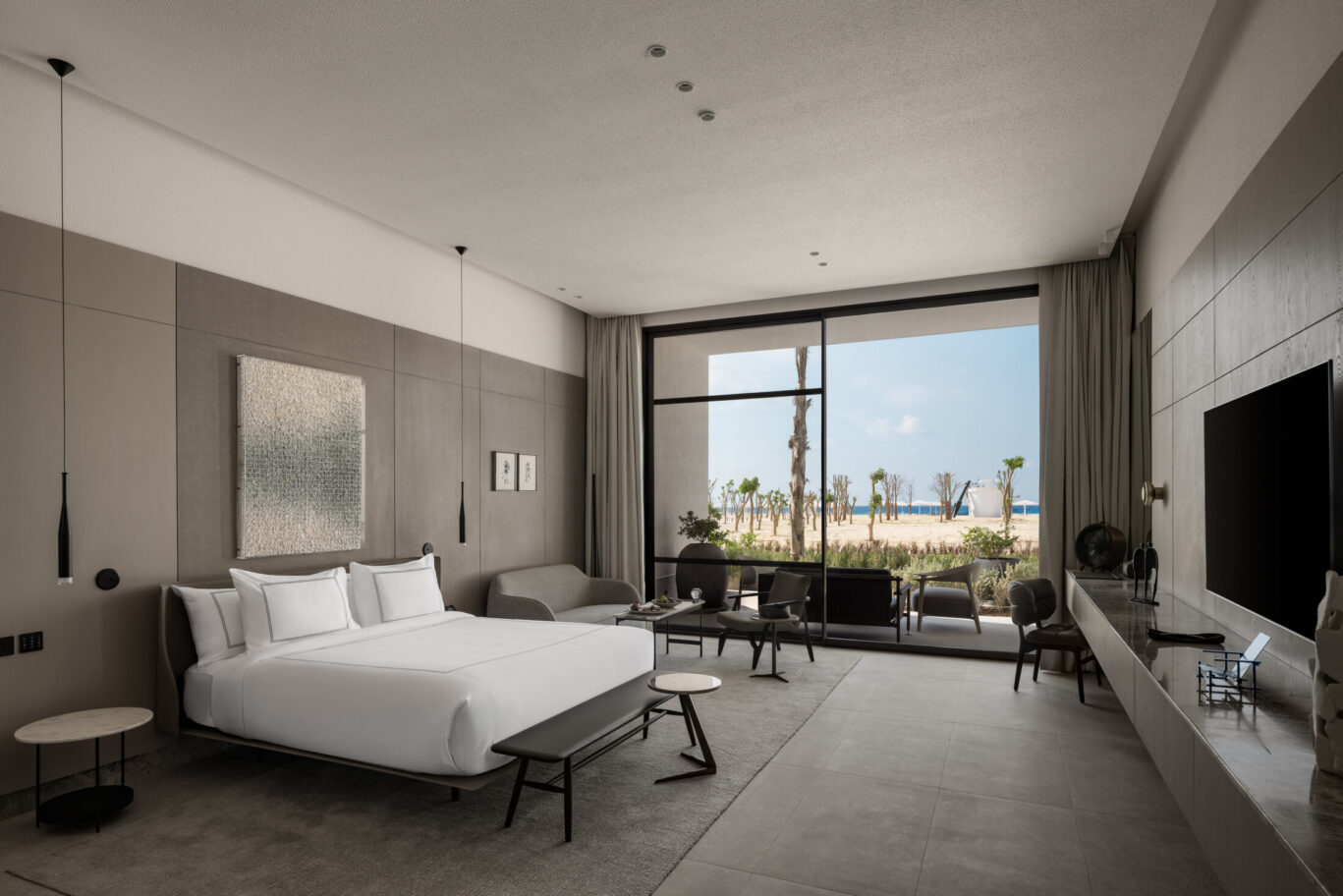 Just beyond, the sea becomes a visual rhythm steady, graceful, and grounding.