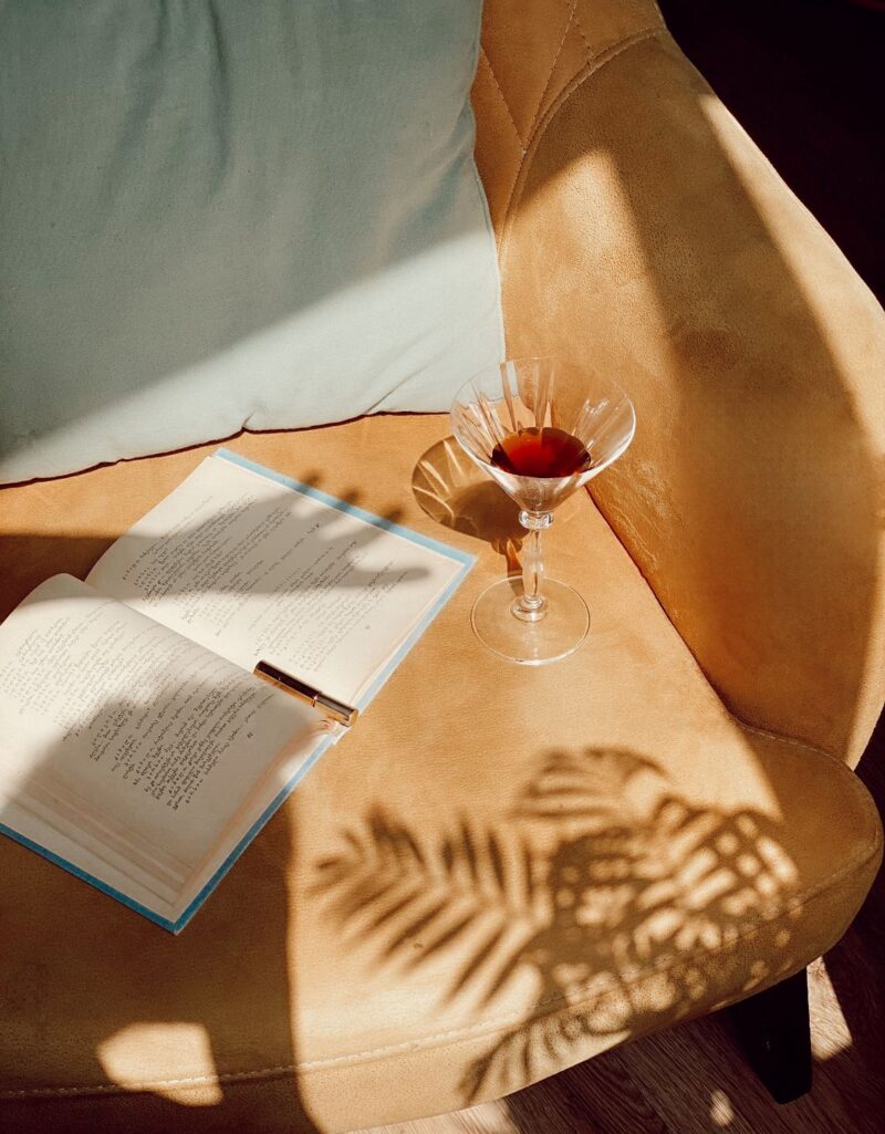 a drink and a book at MY ŌTEL